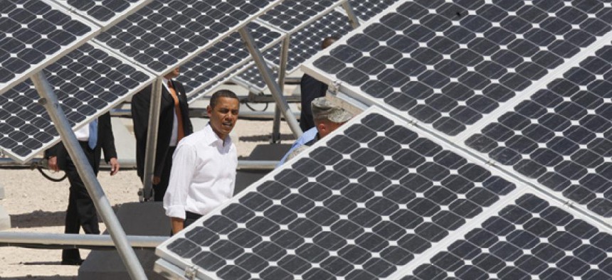 President Barack Obama looks at solar panels at Nevada's Nellis Air Force Base in 2009. 