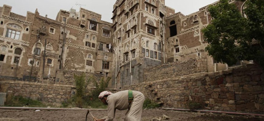 A farmer works on his farm in the old city of Sanaa.