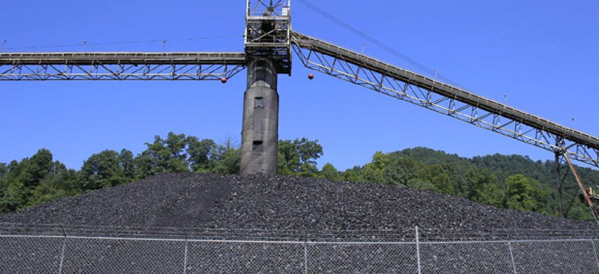 Coal lies in piles around a conveyor system at a Kentucky mine.
