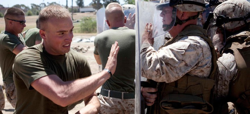Marines in Bravo Company of the 1st Law Enforcement Battalion practice non-lethal crowd control techniques.