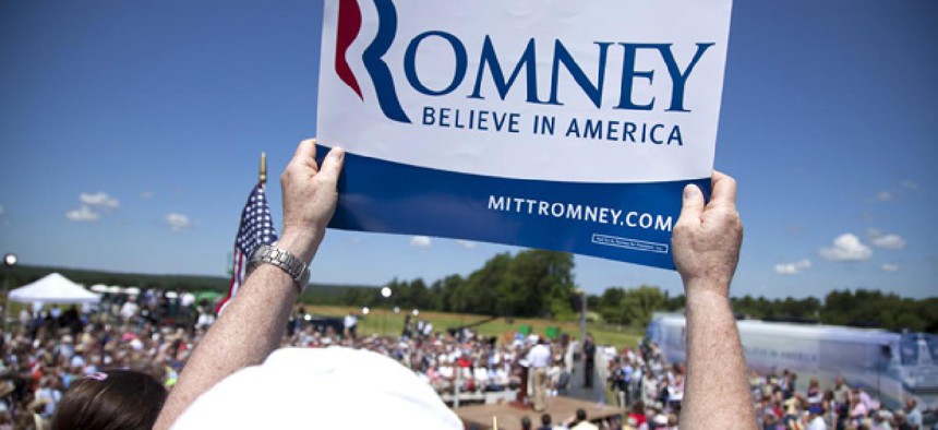 A Mitt Romney supporter holds a sign during a New Hampshire rally.