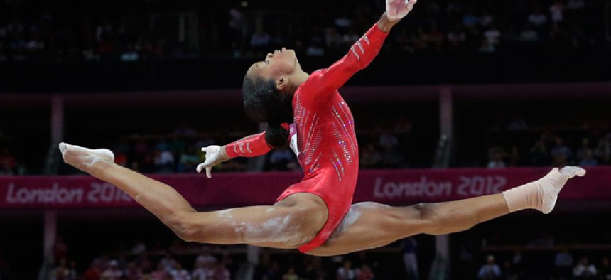 U.S. gymnast Gabrielle Douglas performs on the balance beam at the 2012 Summer Olympics.