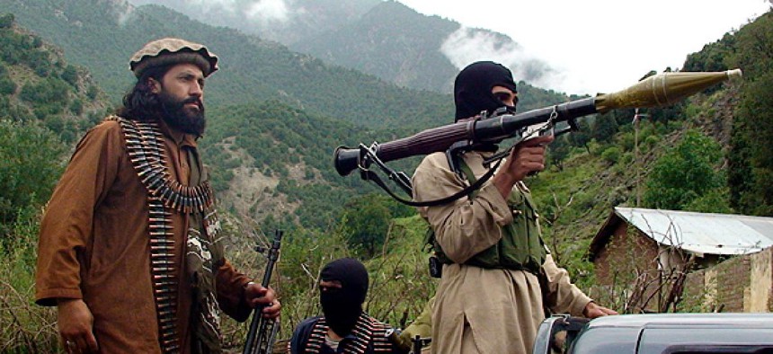 Pakistani Taliban patrol in their stronghold of Shawal in Pakistani tribal region of South Waziristan.