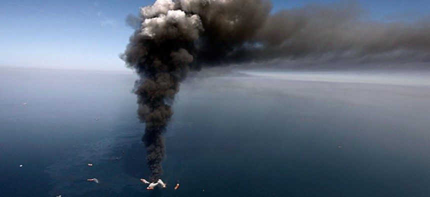 A large plume of smoke rises from fires on BP's Deepwater Horizon offshore oil rig.