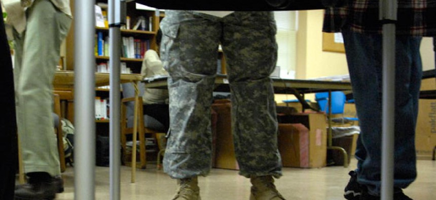 A soldier votes in 2008.