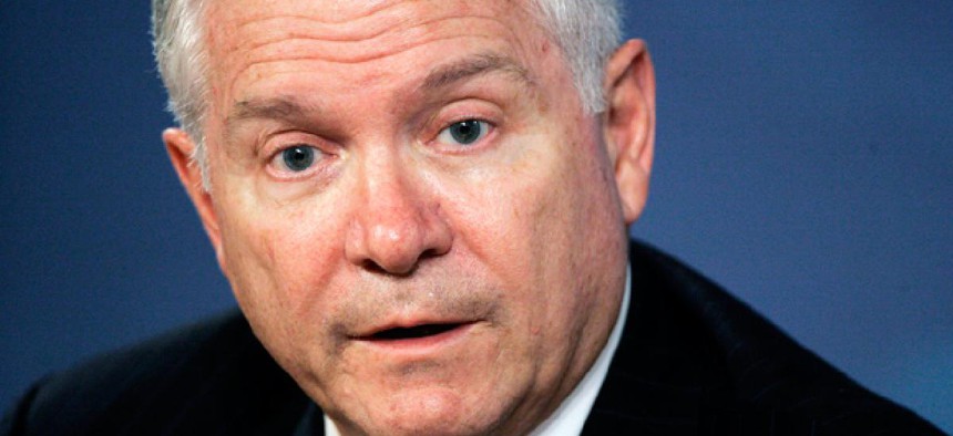 Former Defense Secretary Robert Gates and others blast political culture that allows the threat of automatic cuts to continue.