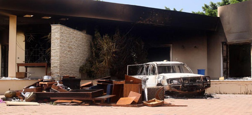 A burnt car stands in front of the U.S. Consulate in Benghazi after the attacks.