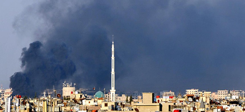 Smoke billows over Damascus.