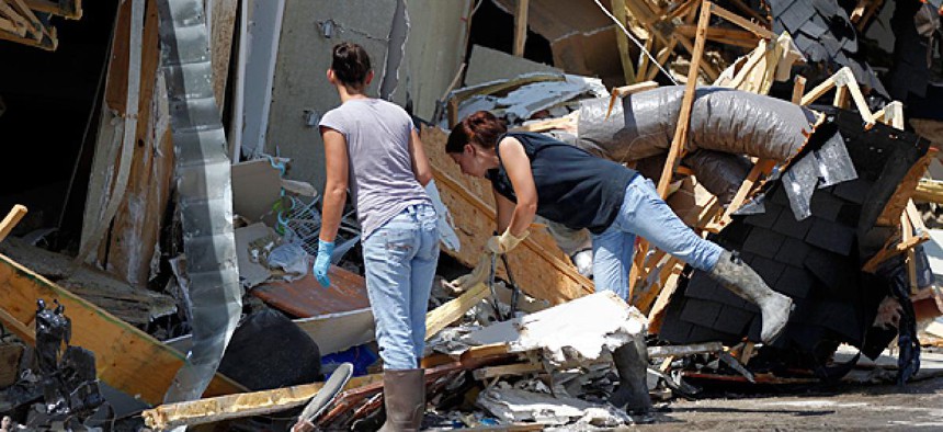 People search for belongings after their home was destroyed by Hurricane Issac.