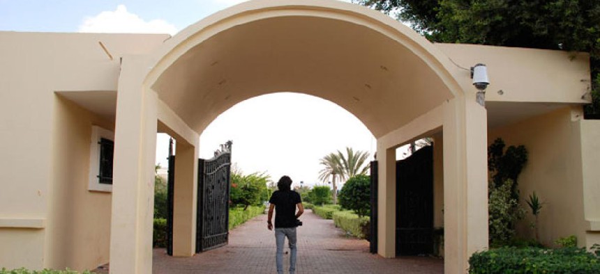A Libyan man walks on the grounds of the U.S. Consulate in Benghazi after it was attacked last month.