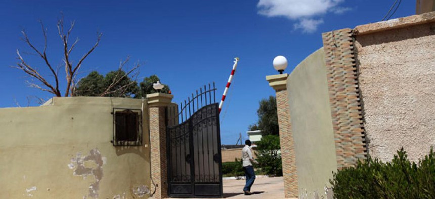 A man walks the grounds of the U.S. Consulate in Bengazi after the attack.