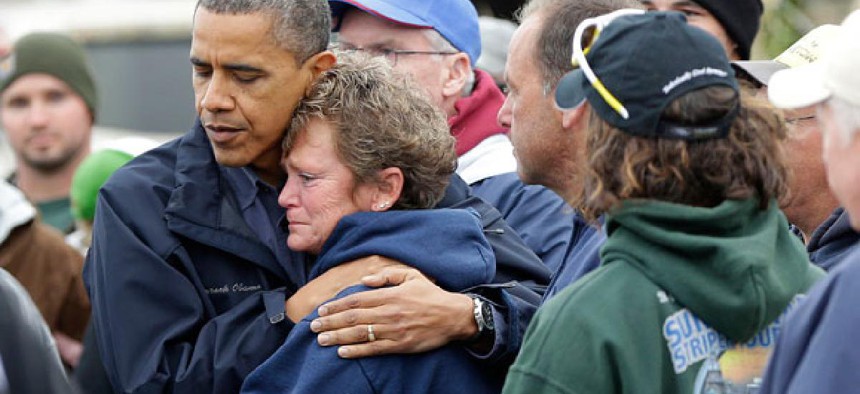 Obama embraces Donna Vanzant in Brigantine, N.J., during a tour assessing the damage in the state Wednesday.
