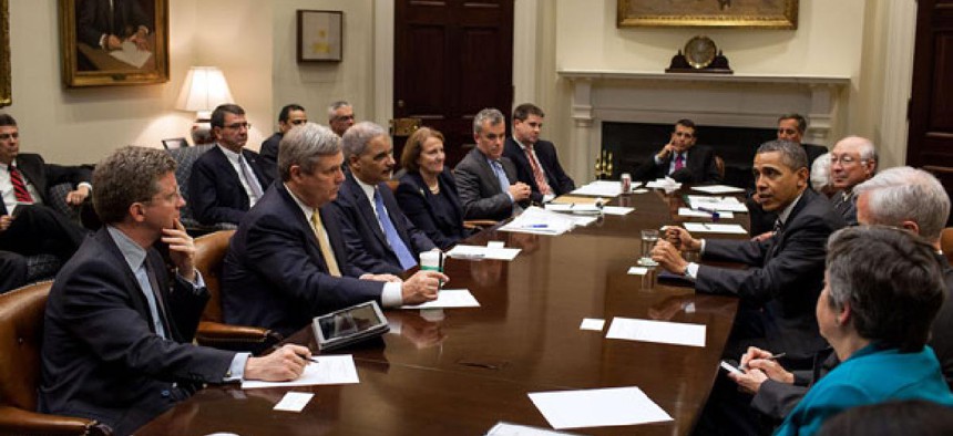 Obama drops in on a cabinet meeting in April.