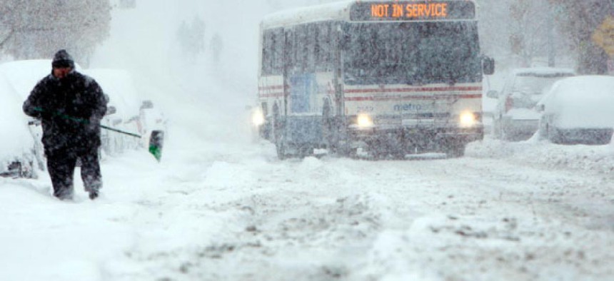 A bus navigates the streets during a snowstorm in Washington, DC in 2009.