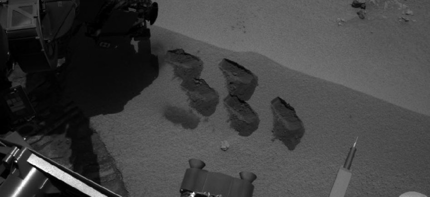 NASA's Mars rover Curiosity used a mechanism on its robotic arm to dig up five scoopfuls of soil, analyzing it with the Sample Analysis at Mars (SAM) suite of instruments inside the rover. (NASA/JPL-Caltech)