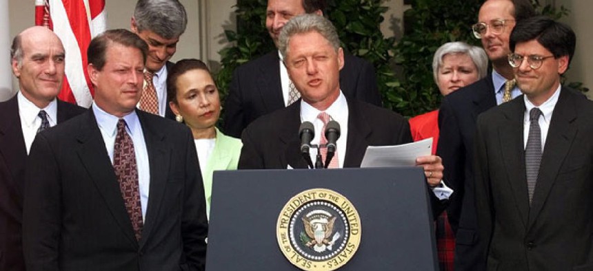 President Clinton, flanked by his economic team, meets reporters in the Rose Garden of the White House Tuesday, May 26, 1998 to discuss the economy. (Doug Mills/AP)