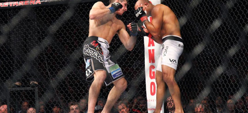 BJ Penn, right, fights Rory MacDonald in an Ultimate Fighting Championship match in December.