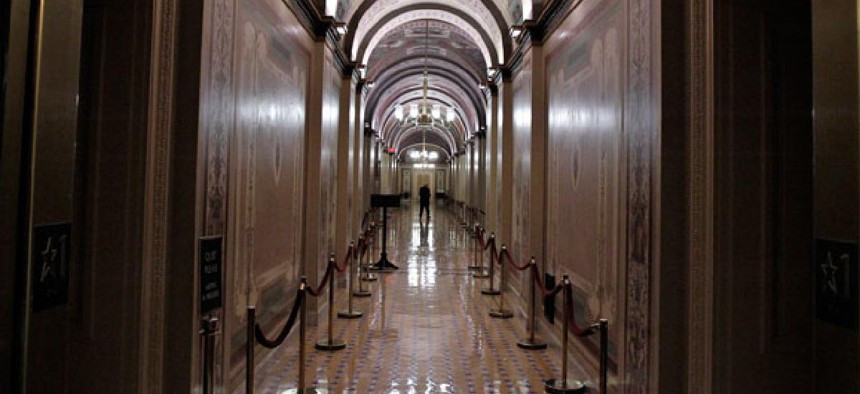 The Brumidi Corridors of the United States Capitol are mostly empty during recess.