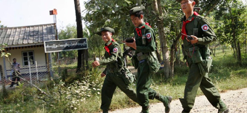 Myanmar soldiers patrol close to Sin Thet Maw relief camp.