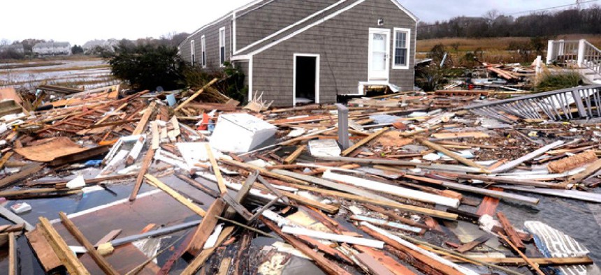 Debris floats around a house pushed off it's foundation in the aftermath of superstorm Sandy.
