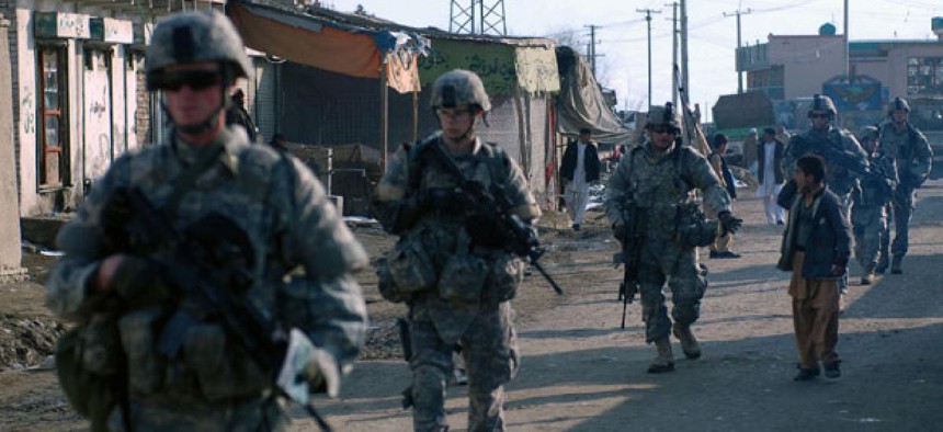 Soldiers conduct foot patrols in Kabul in 2009.