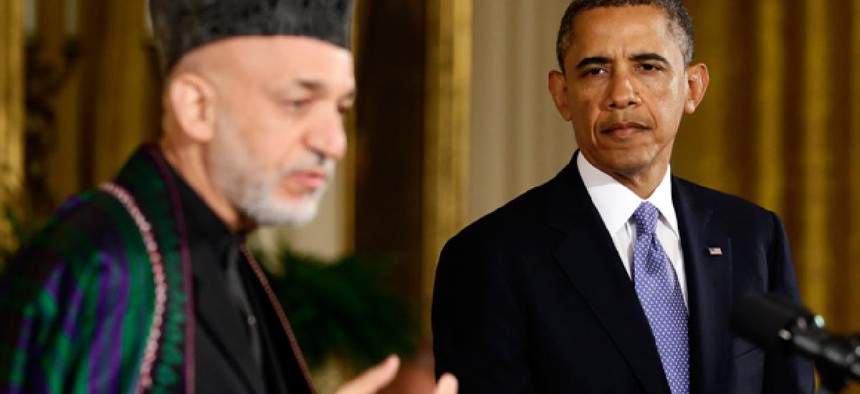 President Barack Obama listens to Afgan President Hamid Karzai 