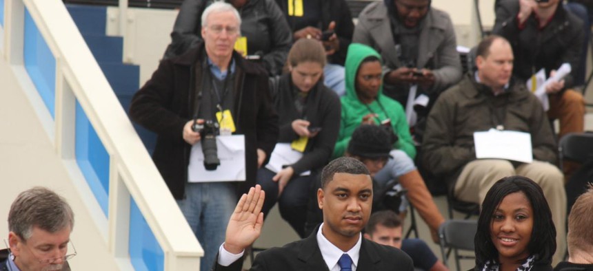 Inaugural Capitol coordinator Matt McGowan, left, directs Air Force Staff Sgt. Serpico Elliott and Army Spc. Delandra Rollins as they stand in for President Barack Obama and first lady Michelle Obama during an inauguration rehearsal Sunday. 
