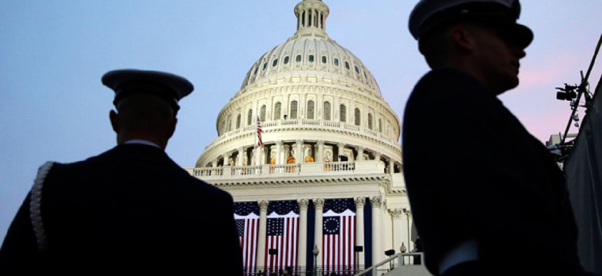 Ceremonial Coast Guard honor guards frame the U.S. Capitol before the ceremonial swearing-in of President Barack Obama during the 57th Presidential Inauguration in Washington.
