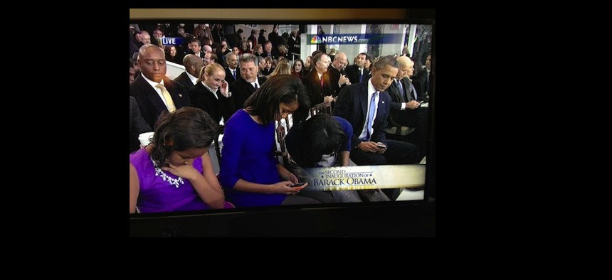 Distractions abound: In an image from the inauguration, the entire Obama family is seen using their smartphones.
