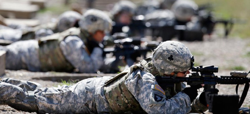 Female soldiers from the 1st Brigade Combat Team, 101st Airborne Division train on a firing range in Fort Campbell, Ky.
