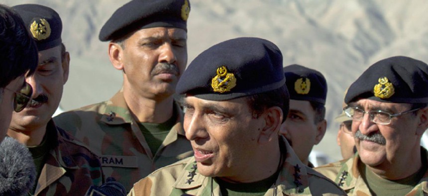 Pakistan's army chief Gen. Ashfaq Parvez Kayani, center, speaks with reporters in 2012.