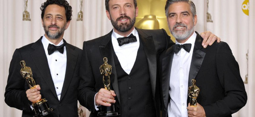 Grant Heslov, from left, Ben Affleck, and George Clooney pose with their award for best picture for "Argo" during the Oscars. 