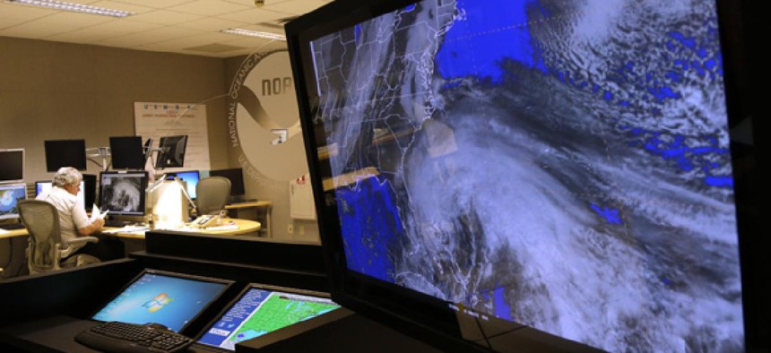A satellite image of Hurricane Sandy is shown on a computer screen at the National Hurricane Center in Miami.