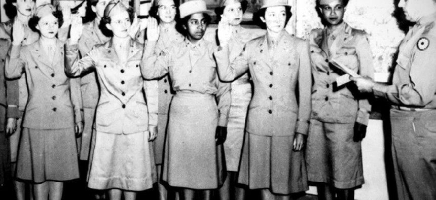 Women Army Auxiliary Corps members are sworn into the Women's Army Corps at Fort Custer, Mich., in 1943