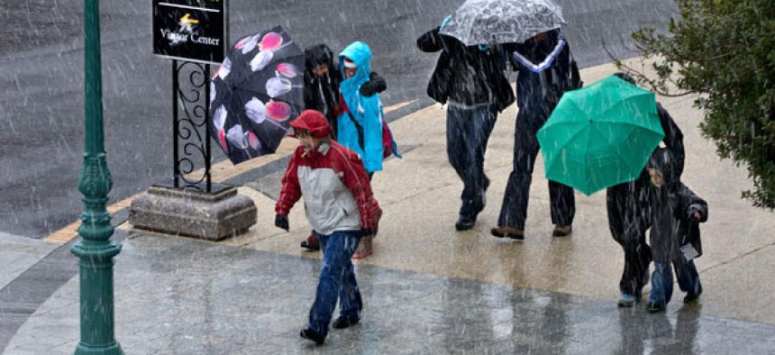 High winds and a mix of rain and snow battered Washington Wednesday.