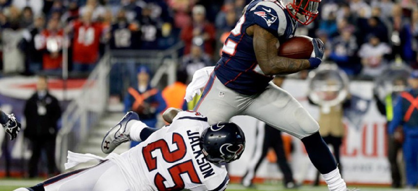 The Texans cornerback Kareem Jackson Houston (25) fails to contain Steven Ridley, running back for the New England Patriots to score a touchdown in the NFL playoffs. 