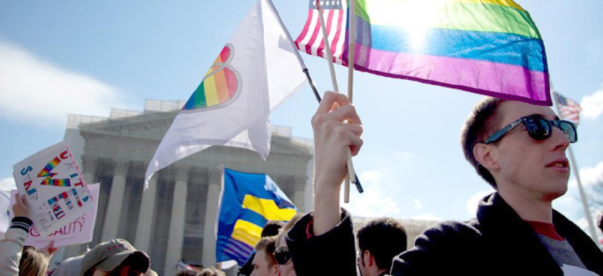 Protesters gather in front of the U.S. Supreme Court, on the second day of gay marriage cases.