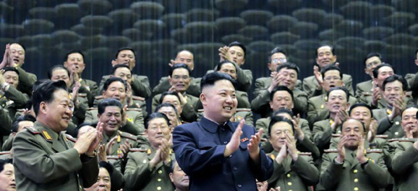 North Korean leader Kim Jong Un applauds as he visits an athletics contest held by Kim Il Sung University of Politics and Kim Il Sung Military University.