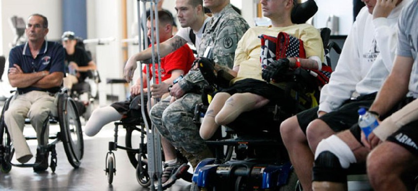 Wounded soldiers involved in physical therapy wait at the Center For The Intrepid at the Brooke Army Medical Center in San Antonio, Texas. Fathers of wounded veterans such as these may soon be eligible for a hiring preference. 