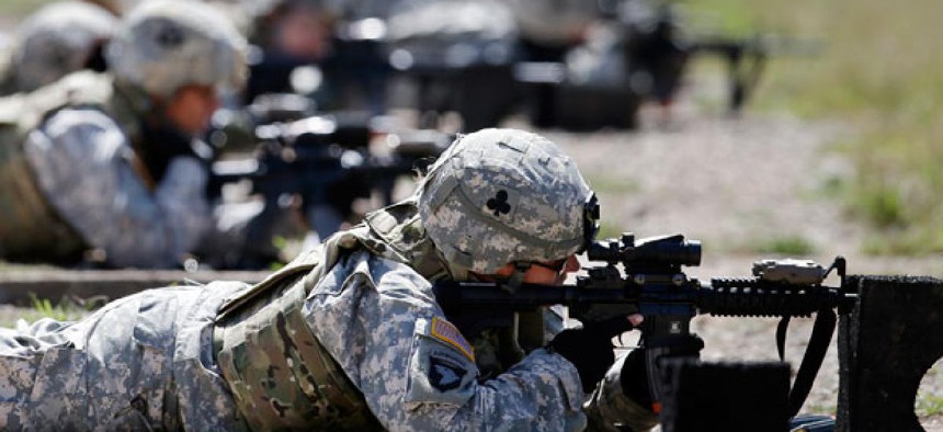 Female soldiers from 1st Brigade Combat Team, 101st Airborne Division train on a firing range in 2012