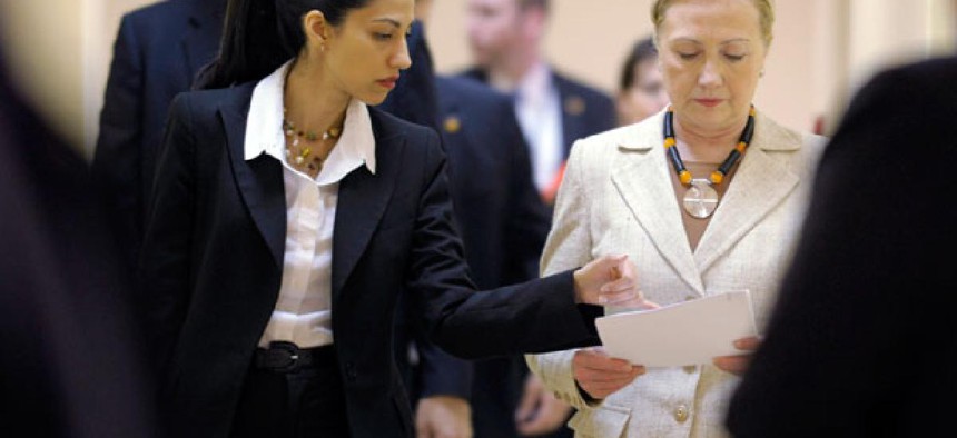 Huma Abedin, left, aide to former Secretary of State Hillary Rodham Clinton, right.