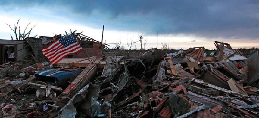 A flag blows in rubble in Oklahoma Tuesday.