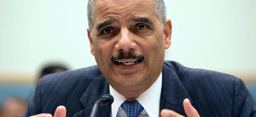 Attorney General Eric Holder gestures while testifying on Capitol Hill in Washington.