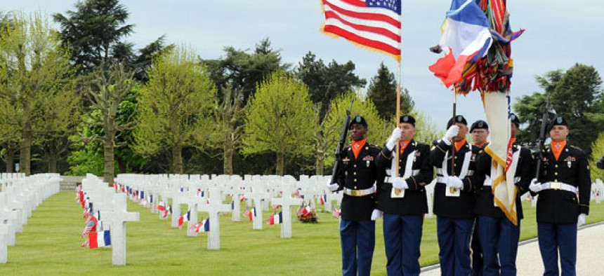 U.S. Army color guard marches at May 26 observation of Memorial Day at the Somme American Cemetery and Memorial in Bony, France. 