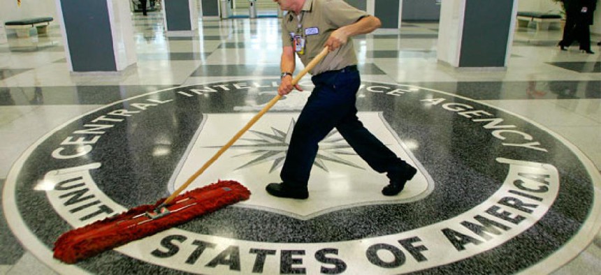 A custodian sweeps the lobby of the CIA.