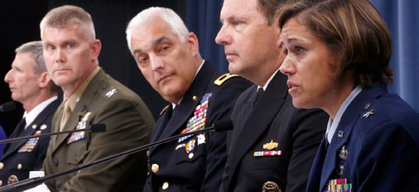 Air Force Brig. Gen. Gina M. Grosso, right, speaks during a news conference at the Pentagon, Tuesday, June 18, 2013, to discuss women in combat. 