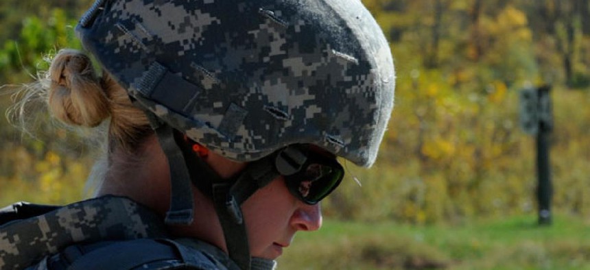 A female soldier goes through a training exercise in 2011.
