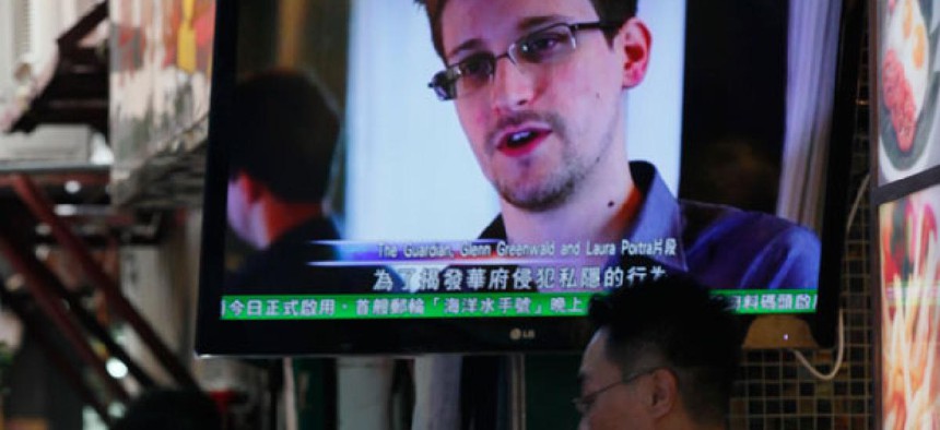 A television shows an interview with Edward Snowden in Hong Kong.