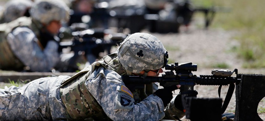 Female soldiers train on a firing range in 2012.