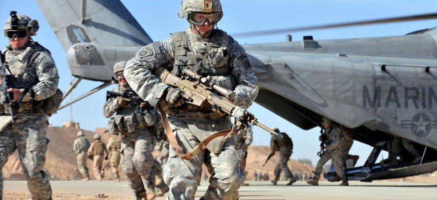 A U.S. Army soldier participates in a static loading exercise at Camp Ramadi, Iraq. Senate appropriators approved a 1 percent pay hike for service members.